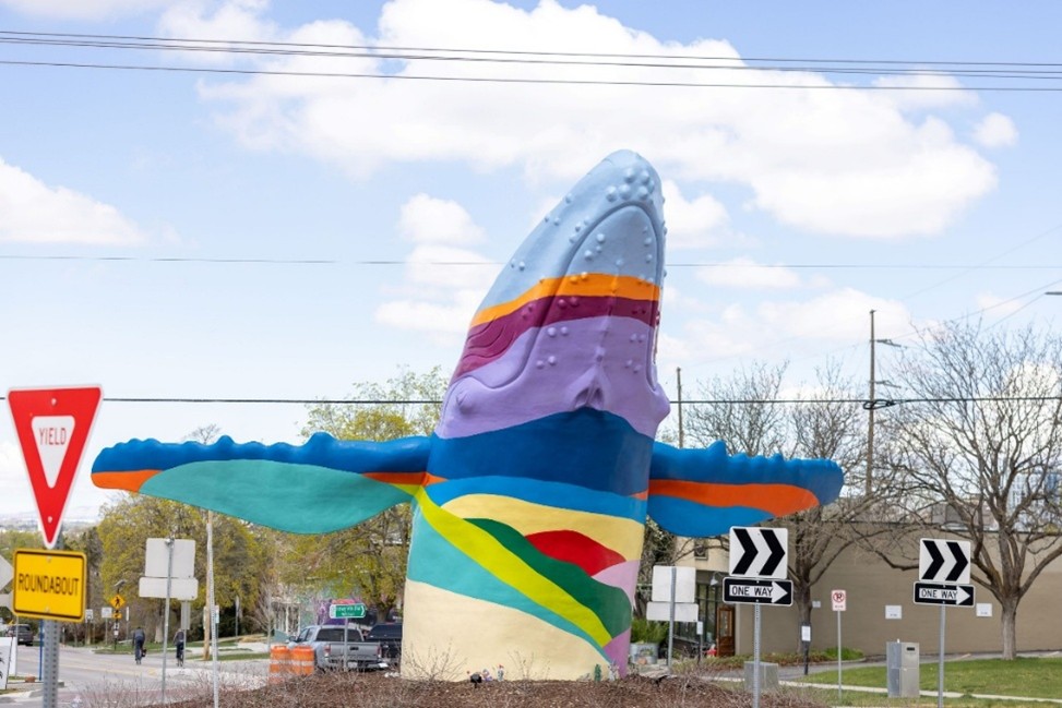 "Out of the Blue" statue by Stephen Kessler, featuring Michael Murdock's mural "Point of Reference". 