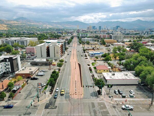 Aerial view photograph looking east along North Temple and Redwood Road toward downtown Salt Lake City.